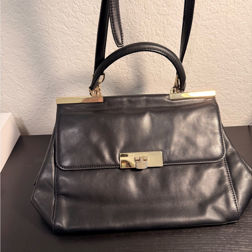 Michael Kors Black and Gold Satchel .